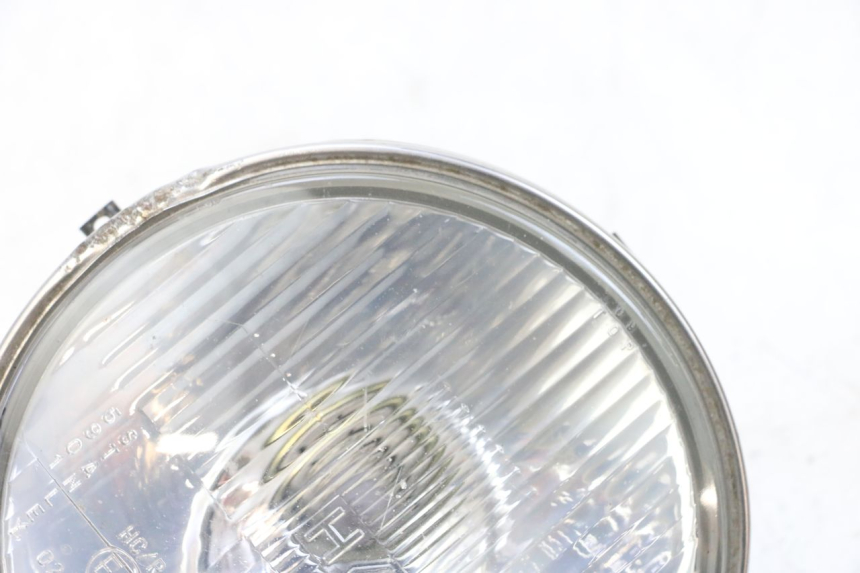 photo de COPERCHIO FARO ANTERIORE  HONDA NTV REVERSE 650 (1988 - 1988) - Stato della superficie e materiale